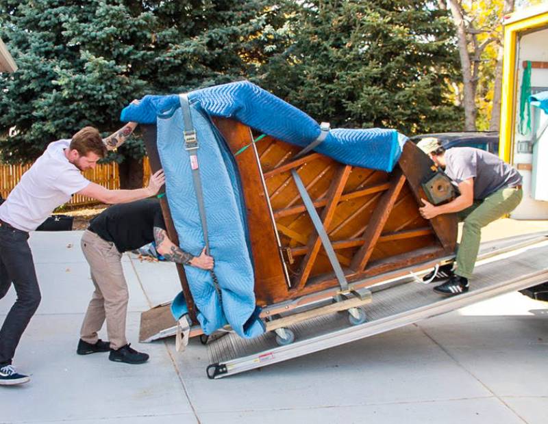 relocation experts moving piano