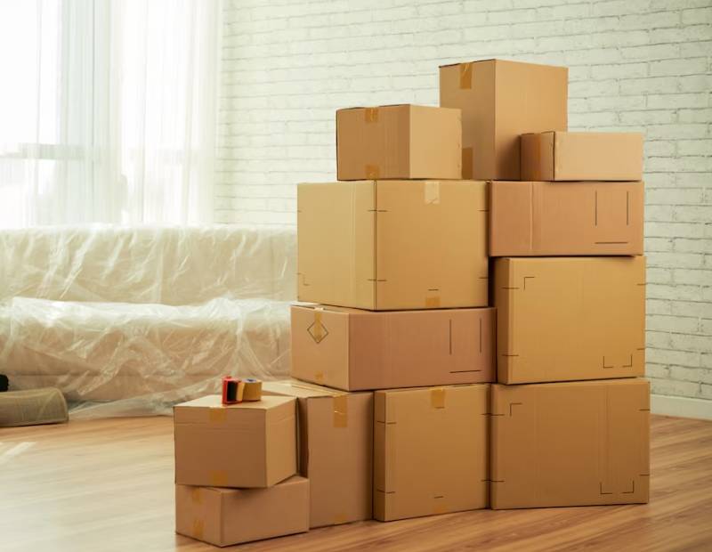 packed cardboard boxes kept in the living room